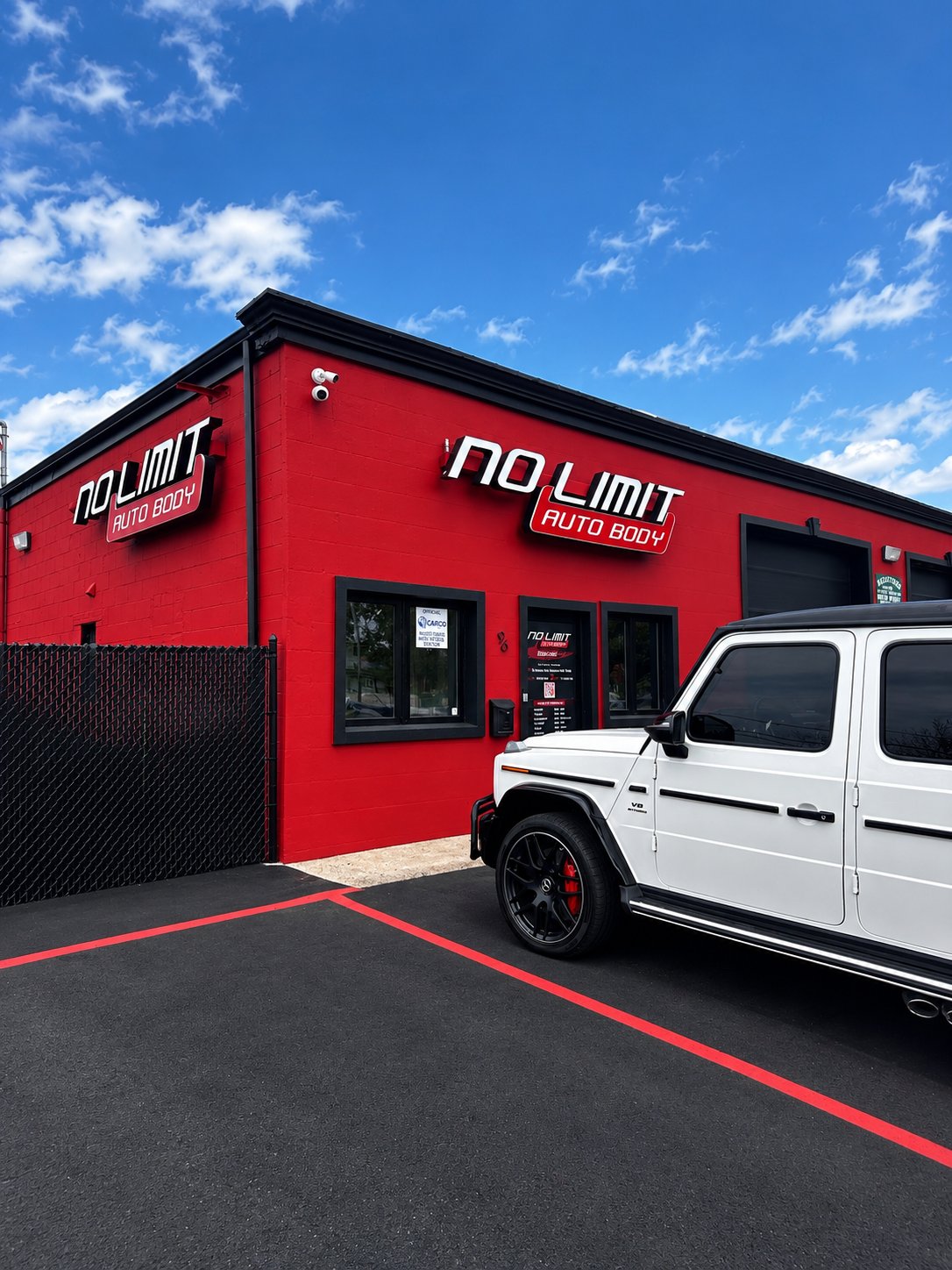White Mercedes G-Wagon parked at No Limit Auto Body
