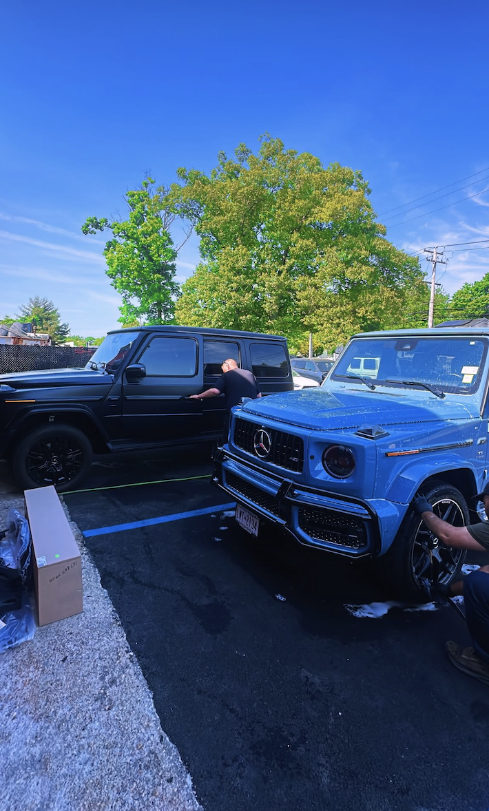 Two Mercedes G-Wagons at No Limit Auto Body parking area