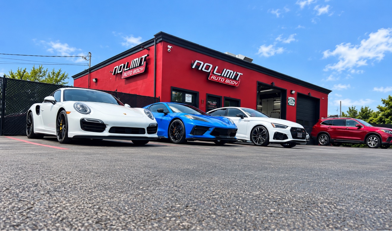White Porsche, blue Corvette and white Audi lined up in front of No Limit Auto Body