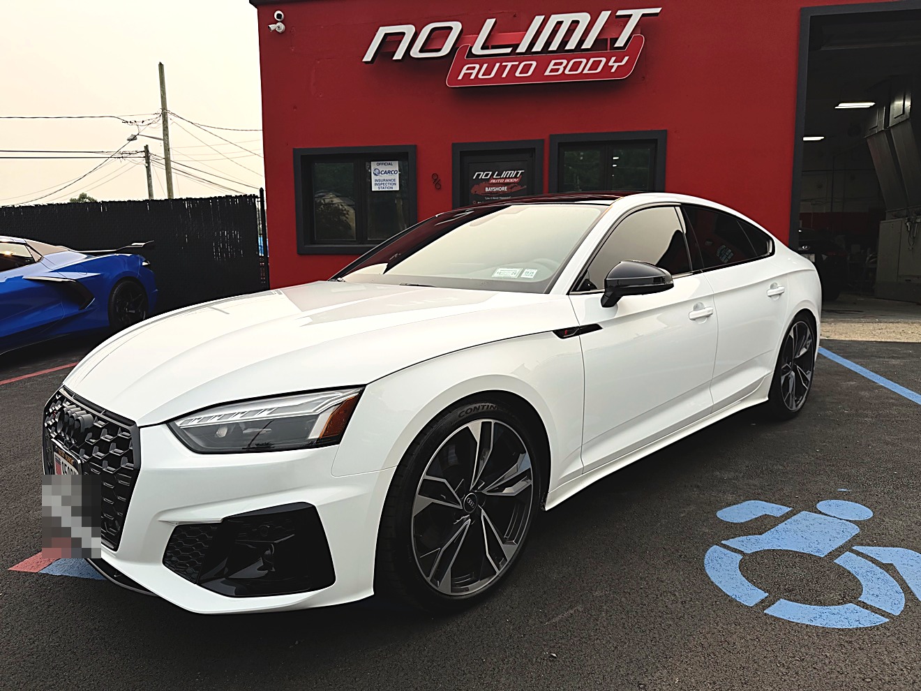 White Audi A5 Sportback at No Limit Auto Body Bay Shore
